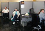 CommCtr (1)_sm Wiscraft's three Communication Center agents sitting at their cubicles.