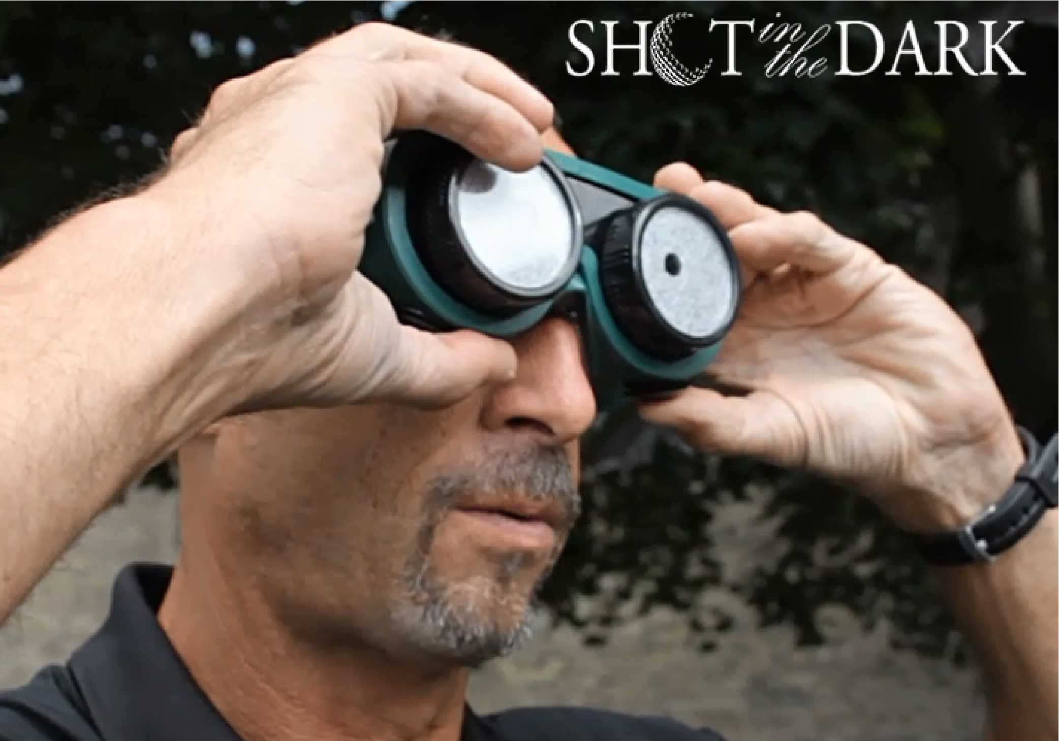 A man wearing visual impairment goggles