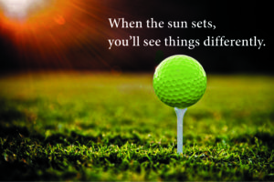 The sun is setting over a golf green. A tee is set with a glowing green golf ball. "When the sun sets, you'll see things differently."