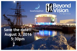 "Save the date - August 3, 2016" Large rocks surround a lagoon. There is a pier in the distance with a masted clipper ship in dock. The Discovery World building is across the way and it is dusk. There are hundreds if not thousands of people on the grounds surround it.