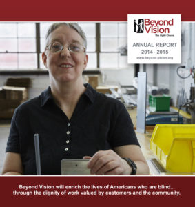 Beyond Vision Annual Report Cover. The logo in the top right and a picture of a woman with glasses holds a couple piece of metal.