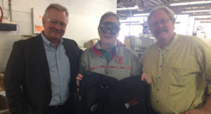 Jim Kerlin and Ron Howski present Gale Klatt with a jacket for his retirement.