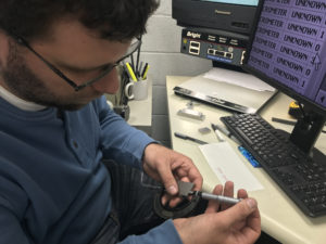 David Ibanez calibrating a measuring tool.