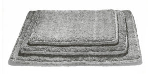 Black and white sales photo of three sizes of cocoa hair mat in a stack.