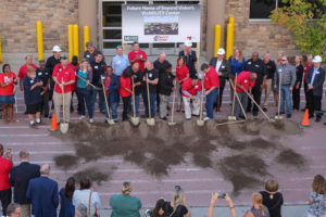 Beyond Vision employees participating in the celebratory shoveling dirt ceremony 