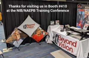 Booth has a table with products on it, and a pop-up display with faces of employees. Thanks for visiting Booth #410 at the NIB/NAEPB Training Conference & Expo