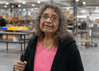 Photo of Sophia Kipp in Beyond Vision's manufacturing area.