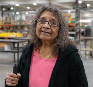 Photo of Sophia Kipp in Beyond Vision's manufacturing area.