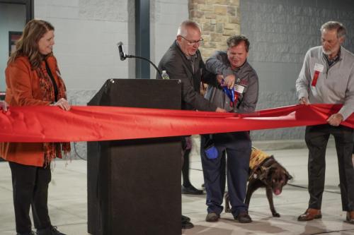Jim Kerlin and board member Jeff Peil cutting the grand opening ribbon.
